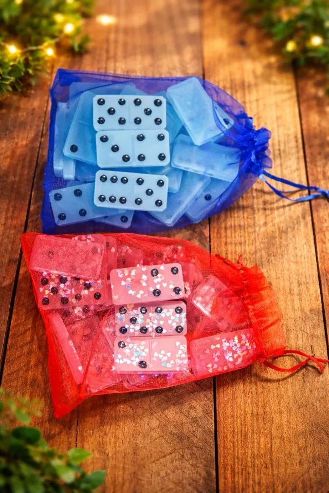 Blue and pink resin domino sets in organza bags